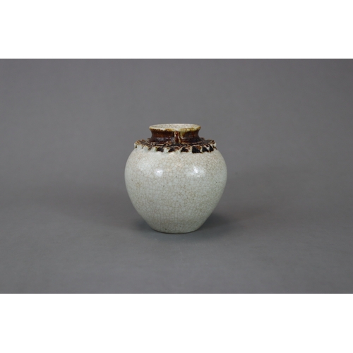 23 - A Rare Vietnamese Celadon Jar, 13/14th century nicely potted and covered overall in a straw glaze, t... 