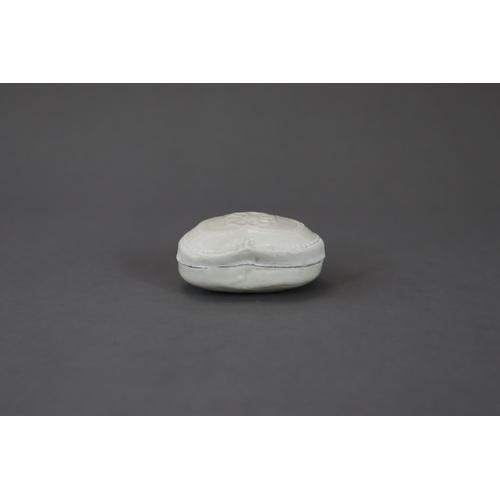 45 - A Rare White-glazed 'trefoil-form' Box and Cover, Five Dynasties, moulded in trefoil shape, a flower... 