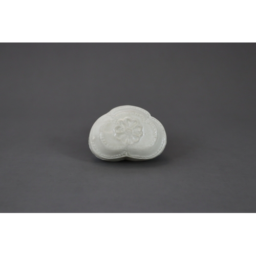 45 - A Rare White-glazed 'trefoil-form' Box and Cover, Five Dynasties, moulded in trefoil shape, a flower... 