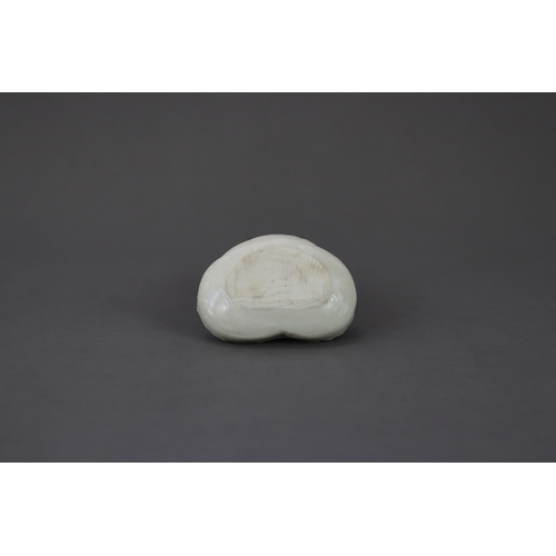 45 - A Rare White-glazed 'trefoil-form' Box and Cover, Five Dynasties, moulded in trefoil shape, a flower... 