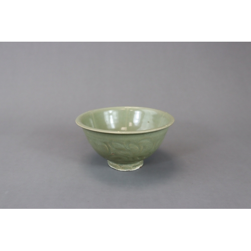 234 - A Yaozhou Celadon Carved 'Peony' Bowl, Song dynasty with deep rounded sides rising from a straight f... 