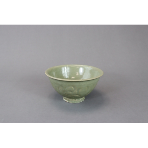 234 - A Yaozhou Celadon Carved 'Peony' Bowl, Song dynasty with deep rounded sides rising from a straight f... 