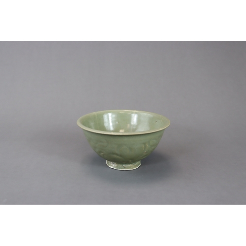 234 - A Yaozhou Celadon Carved 'Peony' Bowl, Song dynasty with deep rounded sides rising from a straight f... 