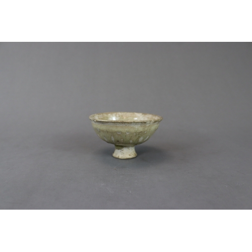 25 - A Celadon-glazed Stemcup, Sui or Yuan dynasty formerly in the Eumorfopoulos collection, of rounded s... 