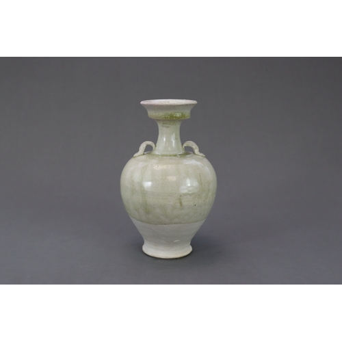 28 - A Rare White-glazed Handled Vase, Sui dynasty the baluster-shaped body rising from a short spreading... 