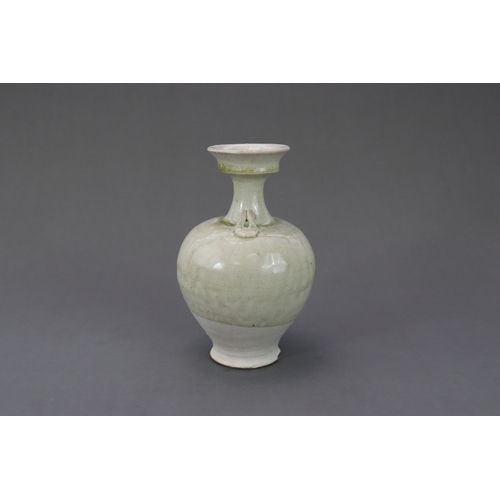 28 - A Rare White-glazed Handled Vase, Sui dynasty the baluster-shaped body rising from a short spreading... 