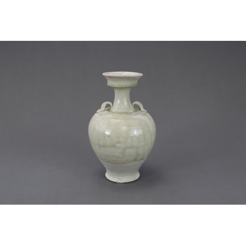 28 - A Rare White-glazed Handled Vase, Sui dynasty the baluster-shaped body rising from a short spreading... 