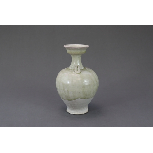 28 - A Rare White-glazed Handled Vase, Sui dynasty the baluster-shaped body rising from a short spreading... 