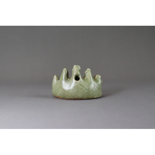 3 - A Longquan Celadon Brushrest-shape Waterdropper, Ming dynasty the crescent-form water dropper modell... 