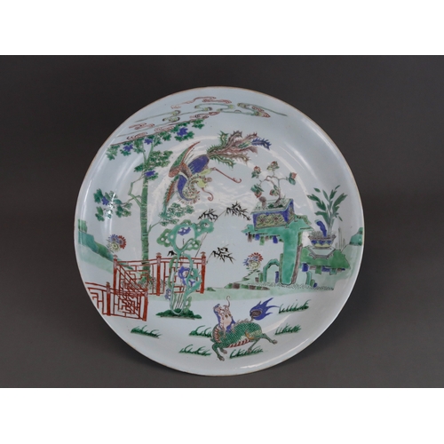 314 - A 'famille verte' Kylin and Phoenix Dish, Kangxi, brightly enamelled with an overall scene of the au... 