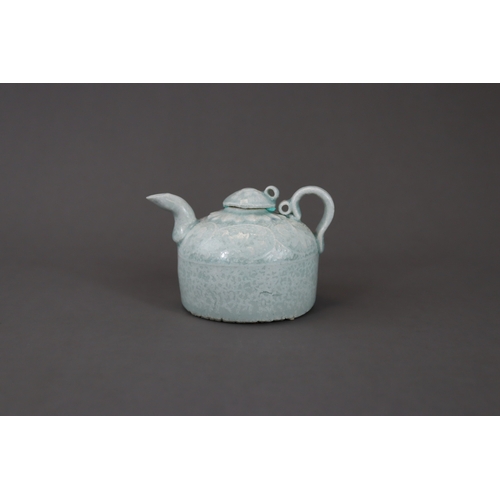 33 - A Qingbai Ewer and Cover, Song dynasty the beehive-shaped body rising from a flat unglazed base, mou... 