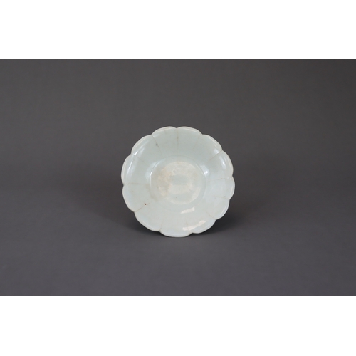 34 - A Qingbai Petal Lobed Dish, Song dynasty with rounded sides rising from a flat base to a gently flar... 