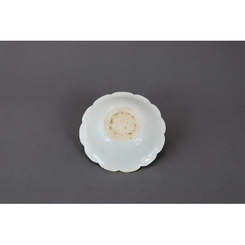 34 - A Qingbai Petal Lobed Dish, Song dynasty with rounded sides rising from a flat base to a gently flar... 