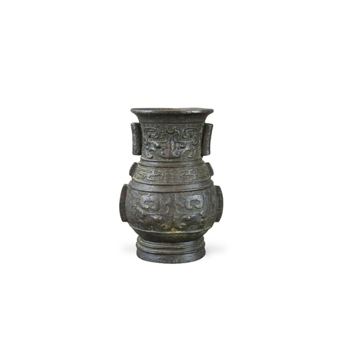 460 - An Archaistic Bronze Vase, hu, Ming dynasty,  the vase of oval section with double arrow handles on ... 