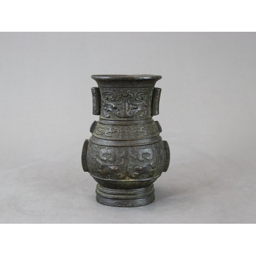 460 - An Archaistic Bronze Vase, hu, Ming dynasty,  the vase of oval section with double arrow handles on ... 