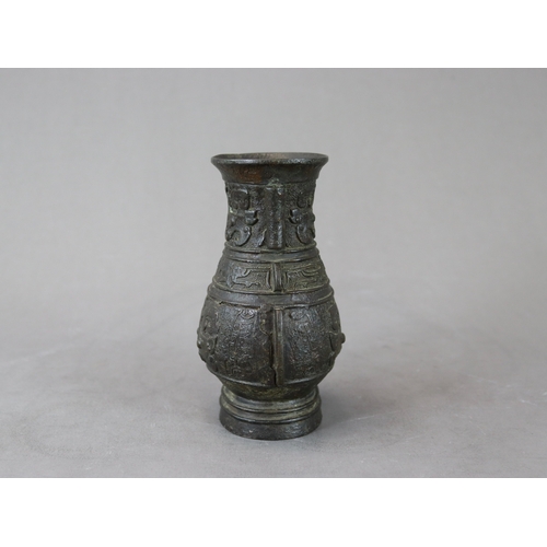 460 - An Archaistic Bronze Vase, hu, Ming dynasty,  the vase of oval section with double arrow handles on ... 