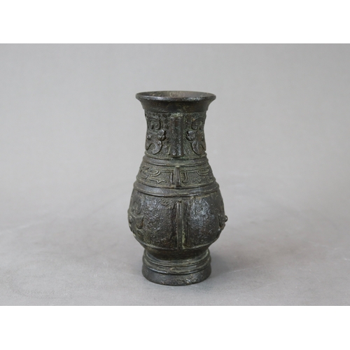 460 - An Archaistic Bronze Vase, hu, Ming dynasty,  the vase of oval section with double arrow handles on ... 