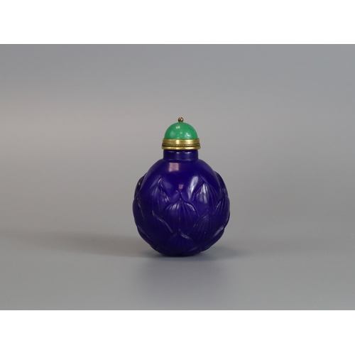 466 - A Blue Pekin Glass Snuff Bottle, 18/19th century,  the deep blue almost globular body well carved as... 