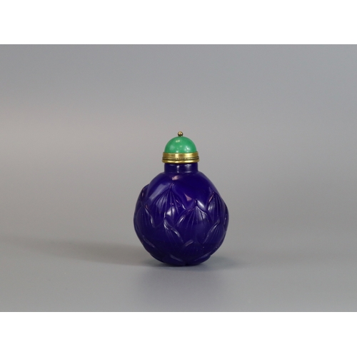 466 - A Blue Pekin Glass Snuff Bottle, 18/19th century,  the deep blue almost globular body well carved as... 