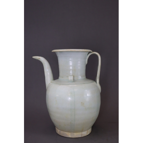 222 - A Qingbai Ewer, Song dynasty the ovoid body raised from the tapered foot to the tall waisted neck an... 