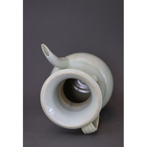 222 - A Qingbai Ewer, Song dynasty the ovoid body raised from the tapered foot to the tall waisted neck an... 