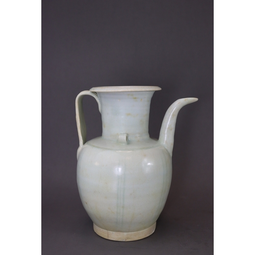 222 - A Qingbai Ewer, Song dynasty the ovoid body raised from the tapered foot to the tall waisted neck an... 