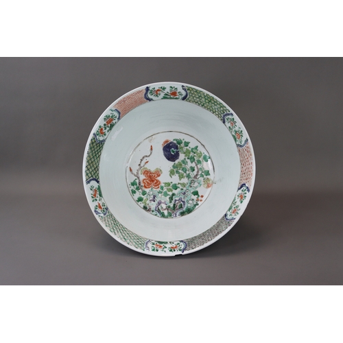 133 - A ‘famille verte’ Punchbowl, Kangxi,	with rounded sides flaring slightly to the rim and decorated on... 