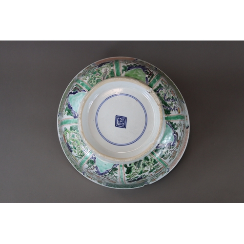 133 - A ‘famille verte’ Punchbowl, Kangxi,	with rounded sides flaring slightly to the rim and decorated on... 