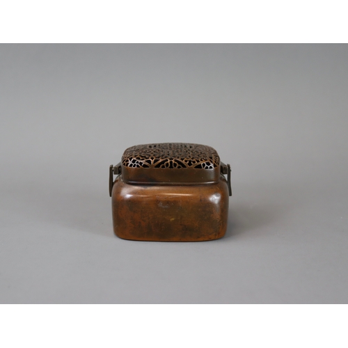 158 - A Copper Alloy Hand Warmer and Cover, 17th century,	with rich dark patina, of  entirely undecorated ... 