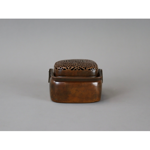 158 - A Copper Alloy Hand Warmer and Cover, 17th century,	with rich dark patina, of  entirely undecorated ... 