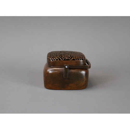 158 - A Copper Alloy Hand Warmer and Cover, 17th century,	with rich dark patina, of  entirely undecorated ... 