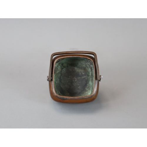 158 - A Copper Alloy Hand Warmer and Cover, 17th century,	with rich dark patina, of  entirely undecorated ... 