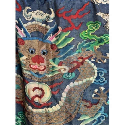 139 - A Silk Kesi Dragon Robe, 19th Century brightly worked with five - clawed dragons in gilt and colours... 