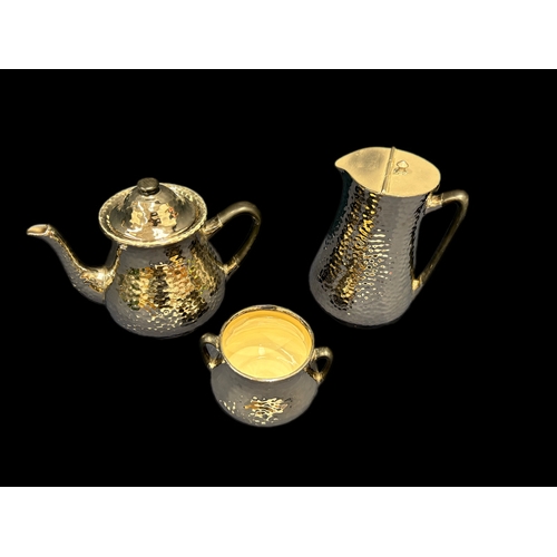 49 - Devon Silverine Fieldings lustre teapot, sugar bowl and hot water jug