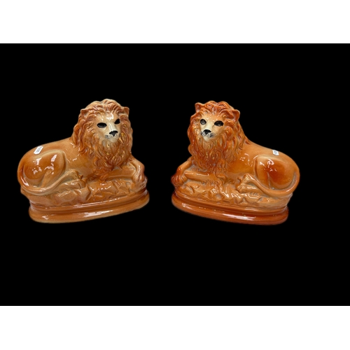 122 - Pair of Victorian Staffordshire lions H25cm