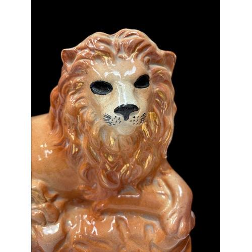 122 - Pair of Victorian Staffordshire lions H25cm