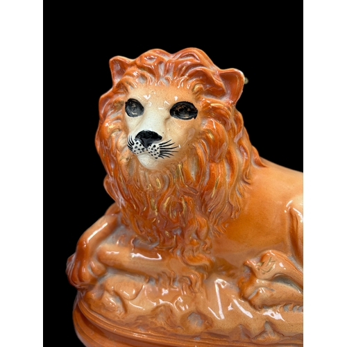 122 - Pair of Victorian Staffordshire lions H25cm