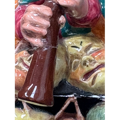 132 - Royal Doulton figurines Pied Piper & The Mask Seller