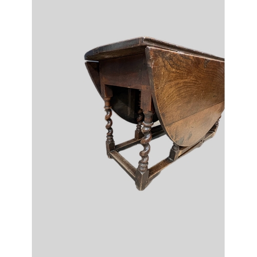 492 - Antique oak gateleg table on barley twist supports
(open 151cm x 131 x 72H) closed 131cm x 50cm ... 