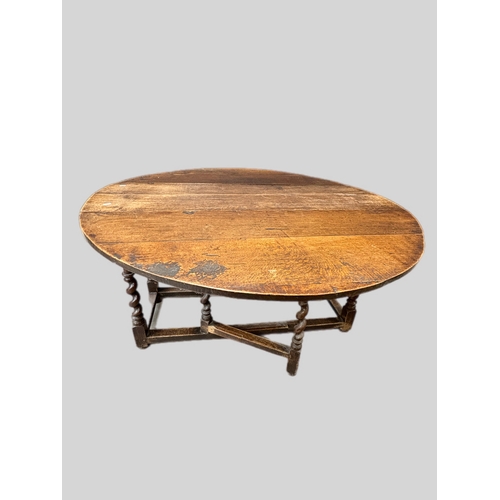 492 - Antique oak gateleg table on barley twist supports
(open 151cm x 131 x 72H) closed 131cm x 50cm ... 
