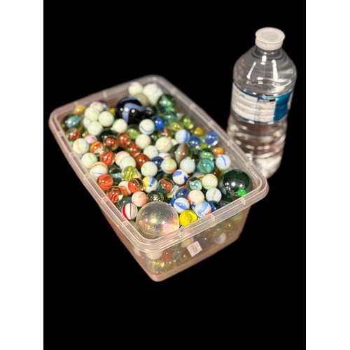 163 - Plastic tub of old glass marbles