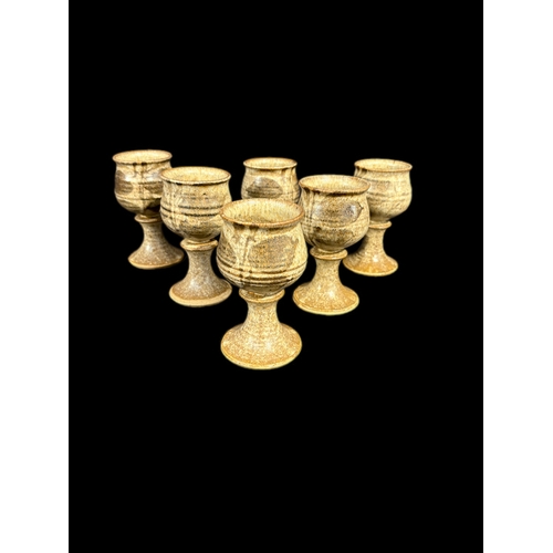 124 - 6 pottery wine goblets 13cm H