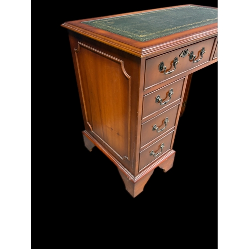 522 - Antique style kneehole desk with tooled leather top and cupboard under 
91.5cm W x 49.5cm D x 75.5cm... 