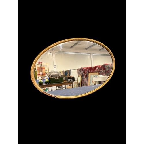 291 - Oval gilt framed mirror 84cm x 55cm 
A/F Missing moulding 