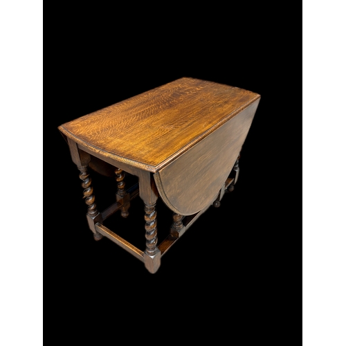 536 - Antique oak gateleg table on barley twist legs