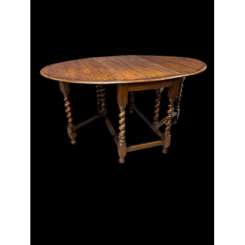 536 - Antique oak gateleg table on barley twist legs