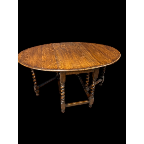 536 - Antique oak gateleg table on barley twist legs