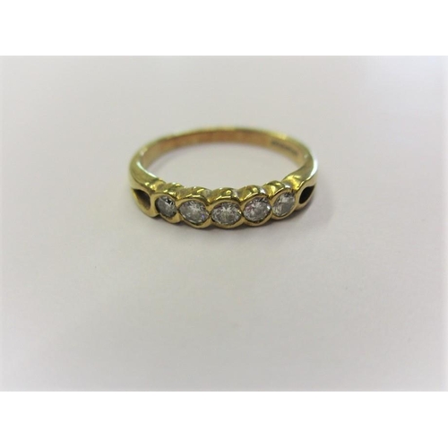 159 - An 18ct yellow gold eternity ring set with 5 diamonds, approx. ring size Q