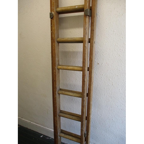 281 - A vintage British rail extending ladder, approx. closed length 184cm