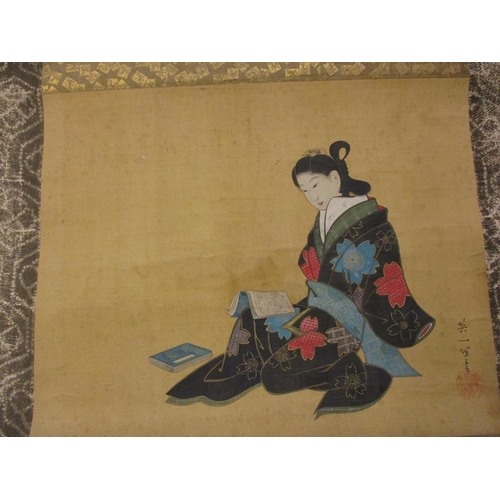 375 - A Japanese scroll painting, signed Hanabusa Itiho, in ink and colours depicting a bijin reading a bo... 